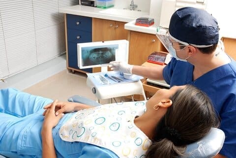 Dentist explaining dental X-ray to patient at Southborough Dental Partners